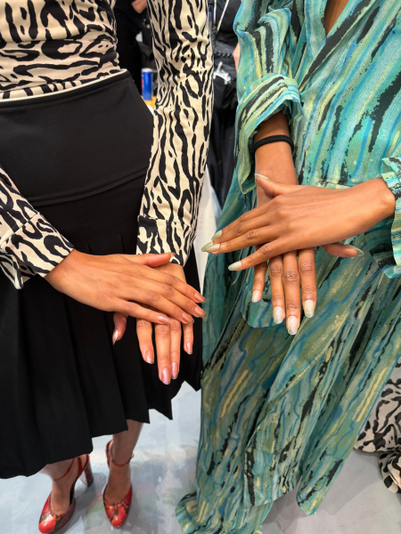 Models show off their nail polish backstage at Fashion Week.