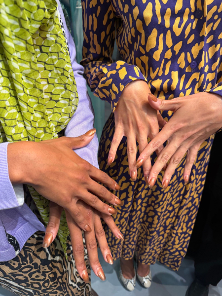 Models show off their sheer sunglass nails.