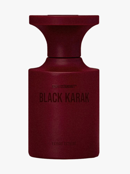 Maroon bottle of Borntostandout Black Karak Extrait on light gray background