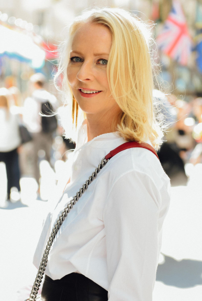 Allure's founding editor in chief Linda Wells poses. for a photo on the street.